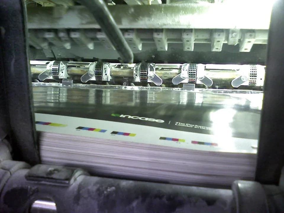Freshly printed brochures coming off the press