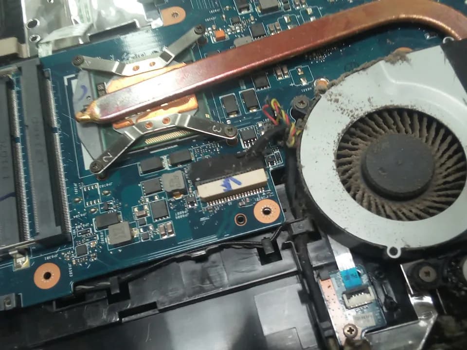 Laptop being cleaned during servicing