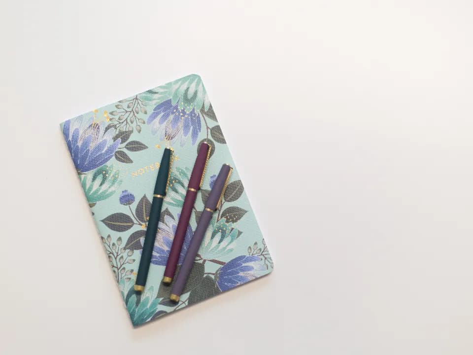 Journal and planner on a desk