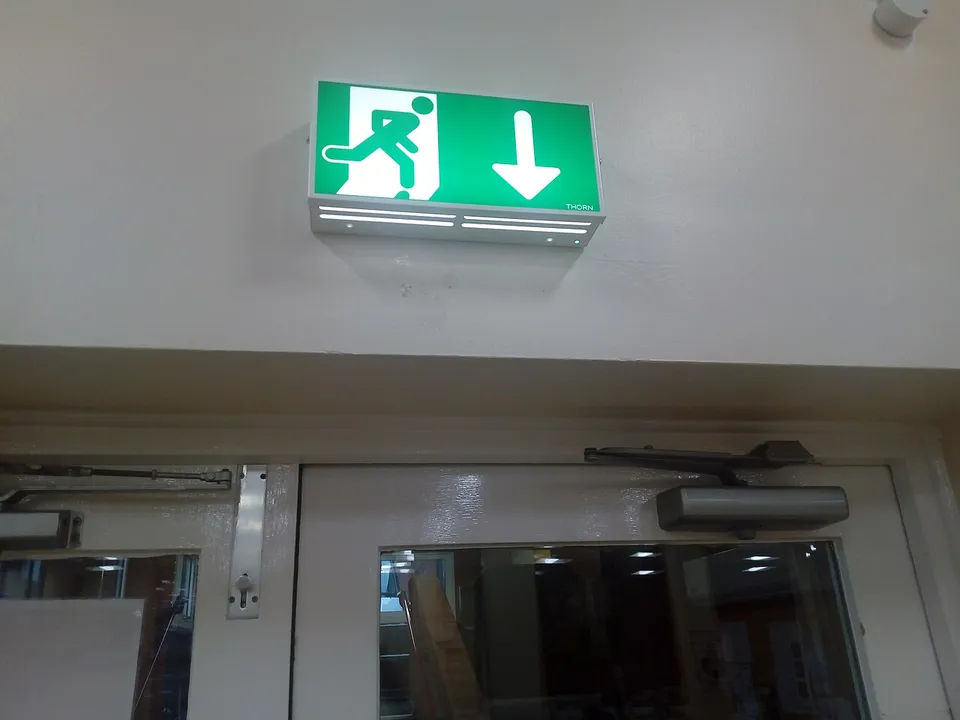 Emergency exit sign above a door