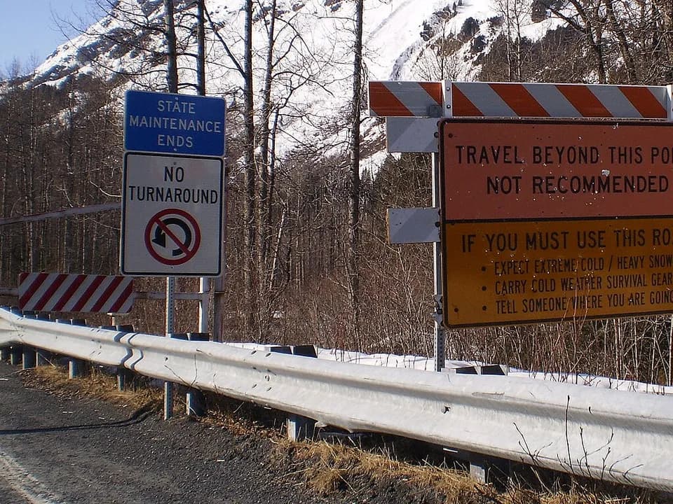 Road signs lining a roadside