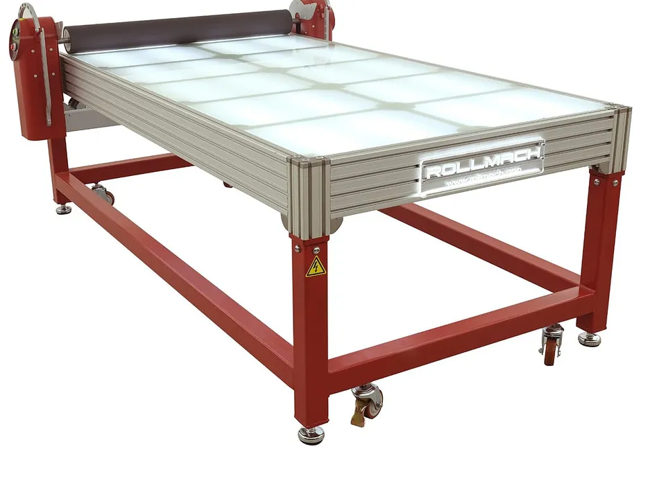 Machine applying printed vinyl to a flat sheet